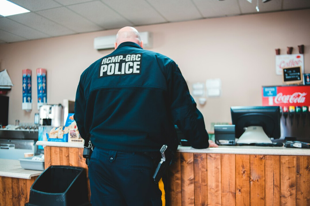 store detective monitoring shoppers
