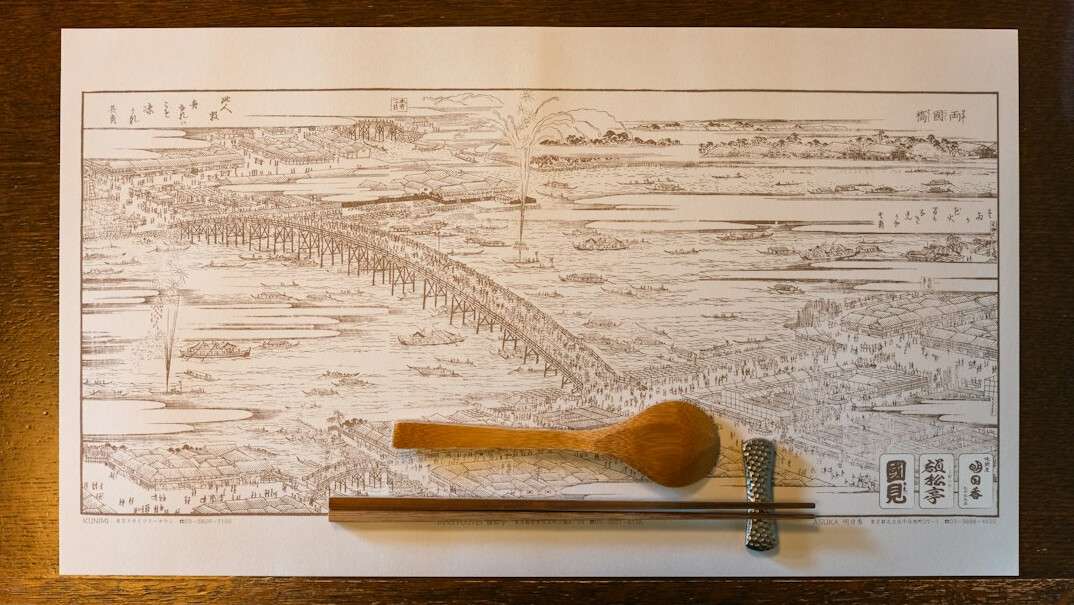Old paper map with a pen on a table